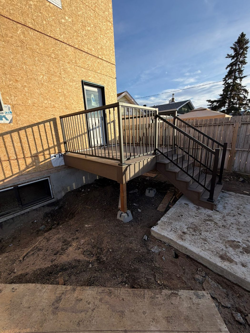 Full deck overview with stairs and metal railing Regina SK