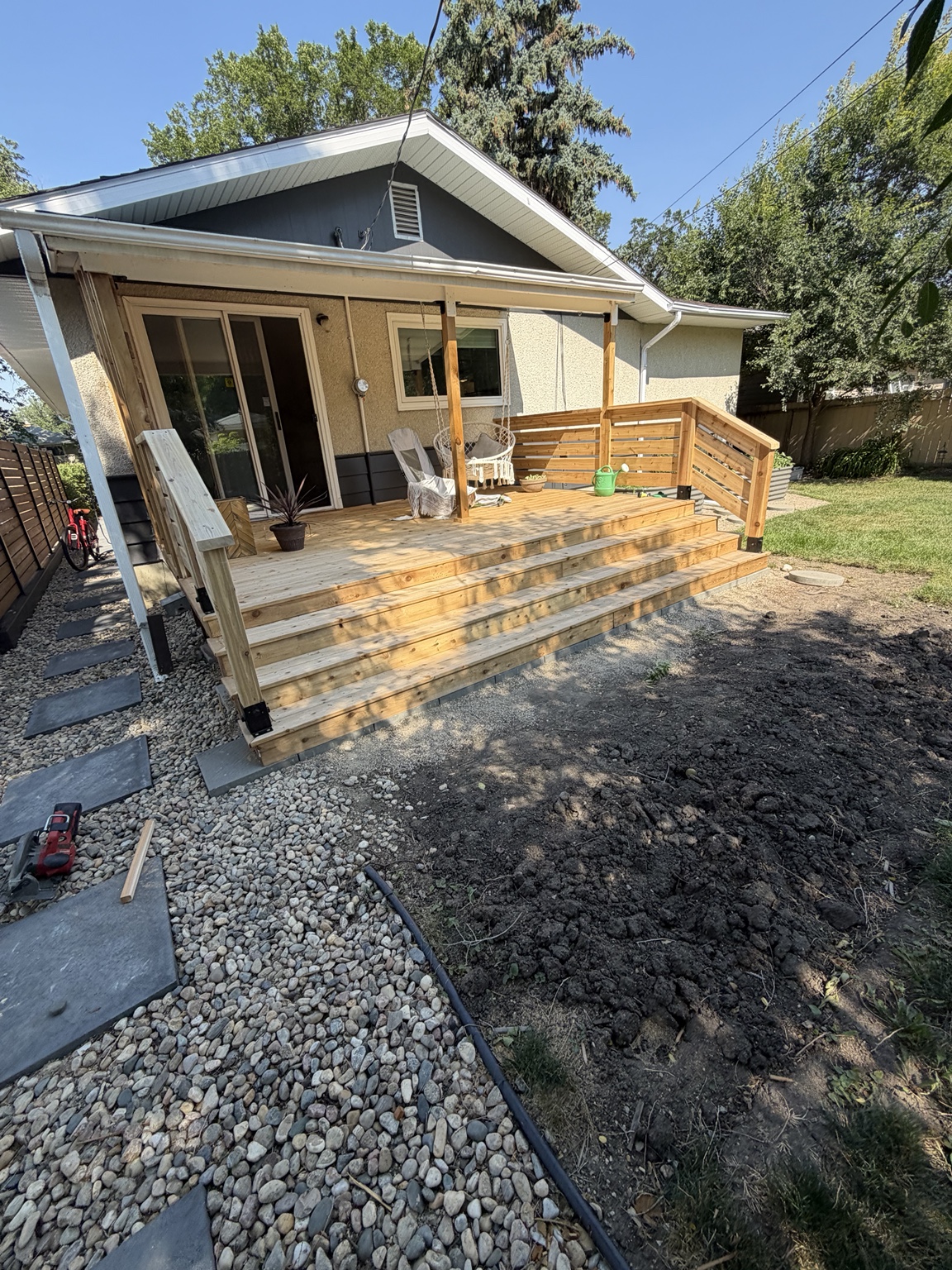 Wood deck with entry steps and horizontal timber railings