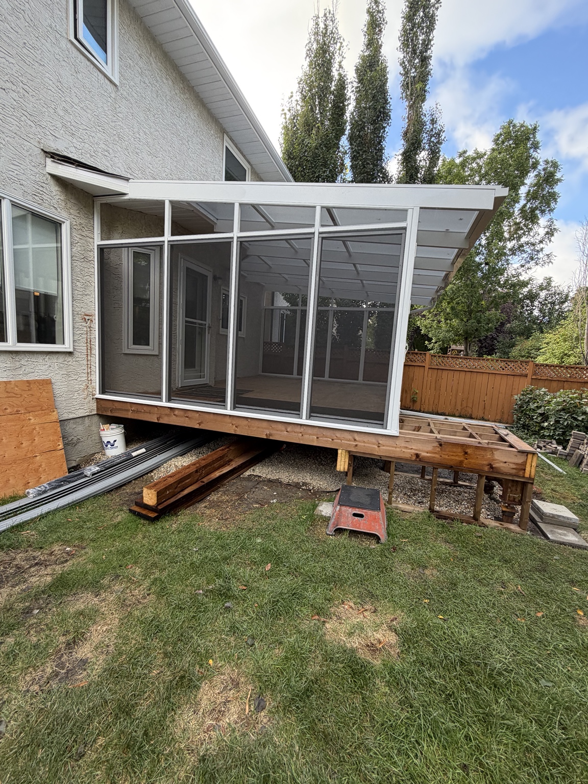 White-framed screen room on a new rear deck